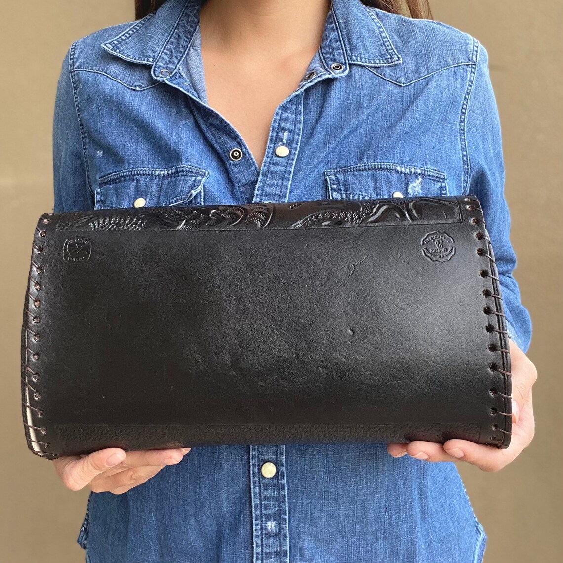 black tooled leather bag