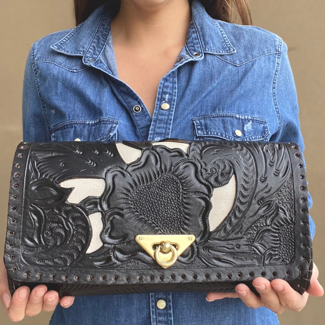 black tooled leather bag