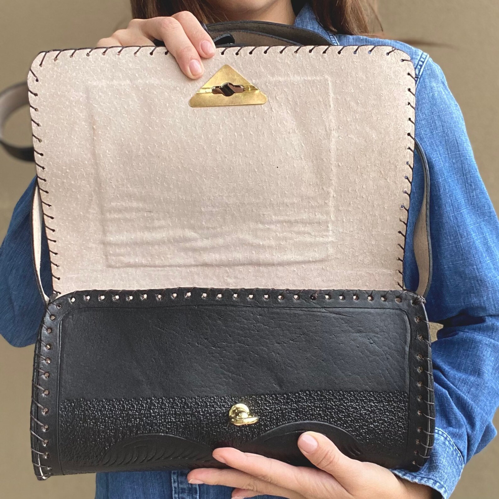 black tooled leather bag
