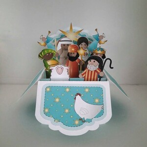 Pop-Up de la Nativité dans une boîte, Blanc, Mangeoire, Sage, Bébé Jésus, Mouton, Sheppard, Anges, Poulet, Étoile, Bleu, Jaune,