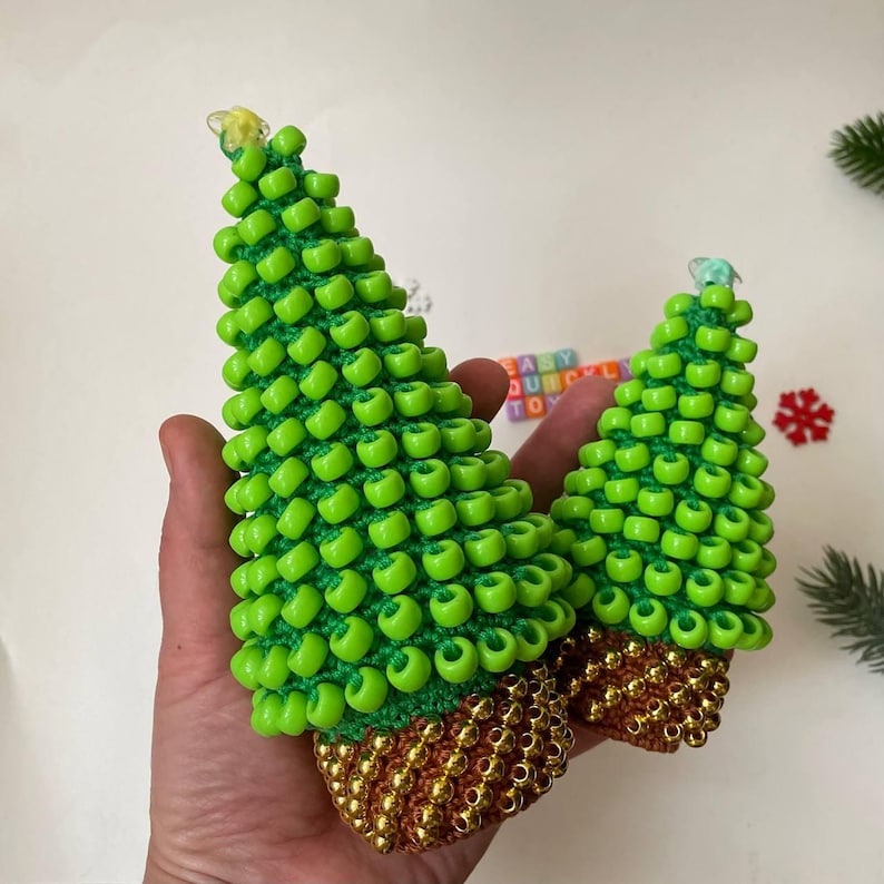 Two finished crochet sensory trees in different sizes, 13cm and 18cm tall