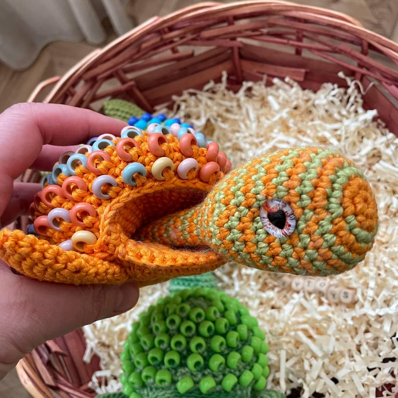 Child pulling tail to activate retractable head fidget feature