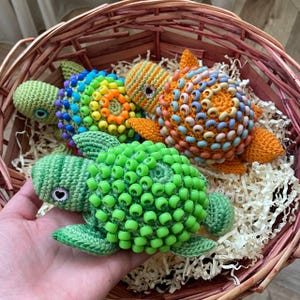 Pony beads on turtle shell for tactile sensory input