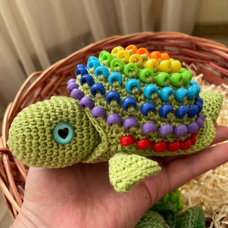 Therapist demonstrating turtle fidget to child with autism