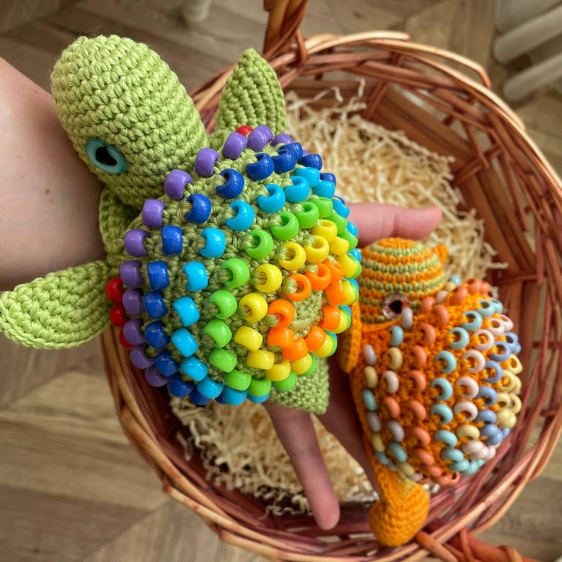 Rainbow sensory toy turtle with head hidden inside shell