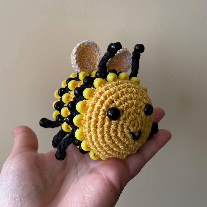 Crochet sensory bee toy with spinning beads for autism and ADHD