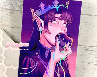 May include: A vibrant art print featuring a stylized illustration of a character with long dark hair, a crown, and pointed ears, biting into a dark, dripping treat. The artwork has a purple and pink color scheme, with the text "Pinky Ashe" visible.