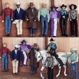 May include: A collection of cowboy-themed dolls, some standing and others with a white horse. The dolls are dressed in various outfits, including denim jeans, cowboy hats, and jackets. The dolls are posed in a wooden setting.