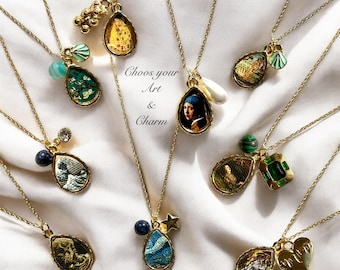 May include: A collection of gold necklaces with teardrop-shaped pendants featuring famous paintings. Each pendant has a different charm attached, such as a pearl, a star, a heart, or a gemstone. The text "Choose your Art & Charm" is written on a white background.