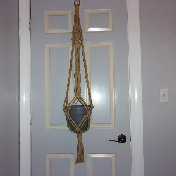 Medium length macrame plant hanger, 40". Made with 6mm jute colored polyolefin rope. Suitable for indoors or outdoors.