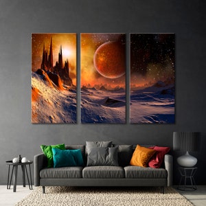 May include: A three-panel canvas print depicting a fantasy landscape with a large, red planet in the sky. The scene features a snow-covered, rocky terrain with a towering, futuristic city in the foreground. The artwork is displayed on a gray wall above a gray sofa with colorful throw pillows.