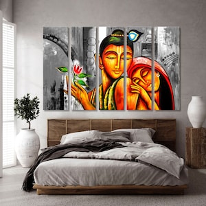 May include: A multi-panel canvas painting depicting a couple embracing. The man has a blue and green headdress and the woman is wearing a red and orange sari. The painting is done in a colorful, stylized style.