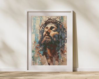 May include: A framed art print featuring a portrait of Jesus wearing a crown of thorns. The artwork uses a textured, painterly style with warm brown, blue, and orange tones. The print is set in a white frame, suitable for religious home decor.