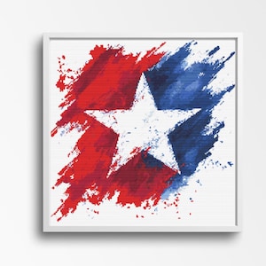 May include: A framed artwork featuring a white star against a backdrop of red and blue brushstrokes. The abstract design evokes a patriotic theme, with the star centered and the colors blending dynamically.