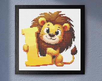May include: Cross-stitch artwork of a smiling lion holding a yellow letter "L". The lion has a brown mane and tail, with a light yellow body. The artwork is framed in a black square frame, set against a white background.