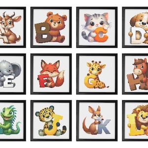 May include: A collection of framed art prints featuring adorable animal illustrations holding alphabet letters. The artwork includes a deer with the letter A, a bear with B, a cat with C, and a dog with D, among others. Each print is in a black frame.