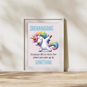 May include: A framed print featuring a white unicorn with a colorful mane and tail, striking a pose. The text above reads "SHENANIGANS", with the phrase "because life is more fun when you are up to SOMETHING" below.