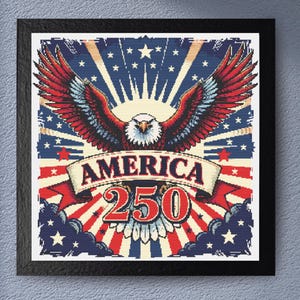 May include: Framed artwork featuring a patriotic design. The image showcases a detailed illustration of an eagle with outstretched wings, set against a backdrop of red, white, and blue elements. The word "AMERICA" is displayed on a banner, with "250" below.