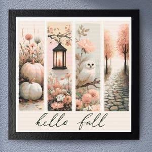 May include: A framed artwork with a fall theme. It features pumpkins, flowers, an owl, a lantern, and a cobblestone path. The words "hello fall" are written in cursive at the bottom. The color palette includes shades of orange, pink, and beige.