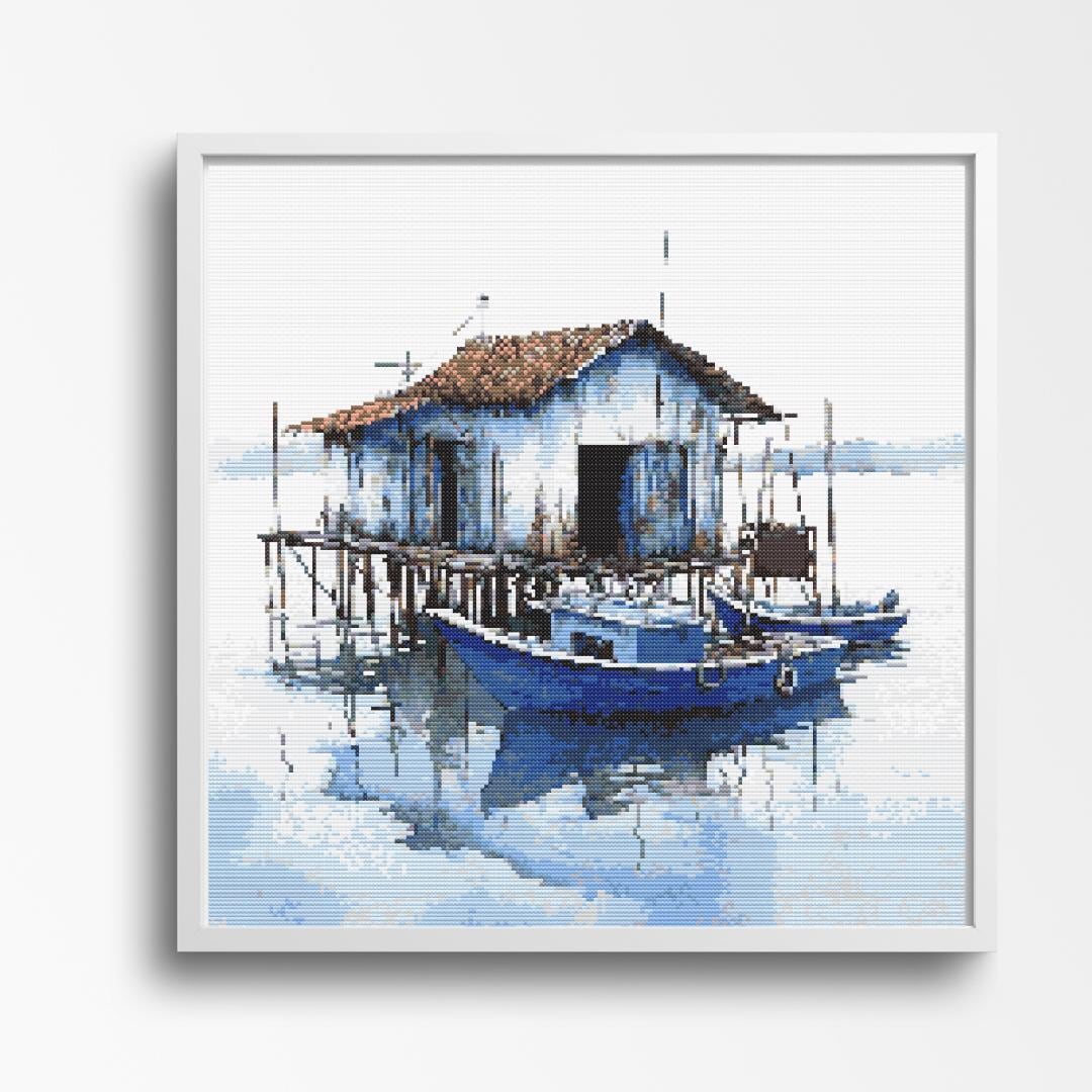 Coastal Tranquility - Serene Waterfront with Boathouse and Reflections - Image 1