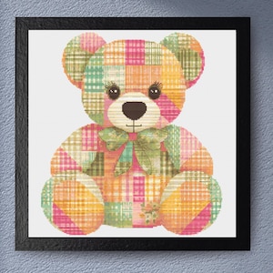 May include: A patchwork teddy bear with a pink, green, orange, and yellow plaid pattern. The bear has a green bow and black eyes.