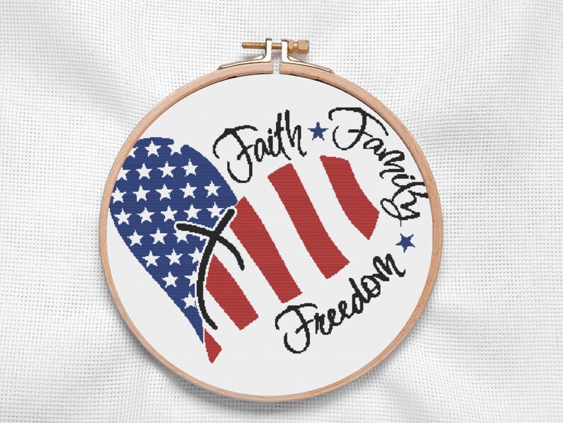 Bold and modern cross stitch pattern featuring the American flag in a heart shape. Vivid navy stars and red stripes wrap around elegant hand-lettered script, ideal for Independence Day or military family gifts. Perfect for patriotic home decor with a personal handmade touch.