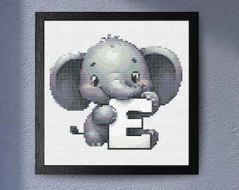 May include: Cross-stitch art of a gray elephant holding a white letter "E". The elephant has large ears and is smiling. The artwork is framed in a black square frame, suitable for nursery decor.