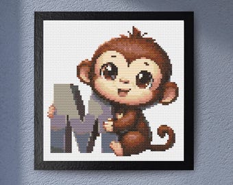 May include: Cross-stitch artwork of a brown monkey holding a letter "M". The monkey has large, expressive eyes and is smiling. The letter is in shades of gray and purple. The artwork is framed in a black square frame.