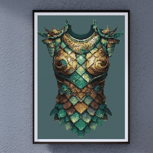 May include: A framed print of a fantasy-themed chest armor. The armor is rendered in shades of gold, green, and brown, with a detailed, textured appearance. The design features overlapping scales and ornate detailing, set against a teal background.
