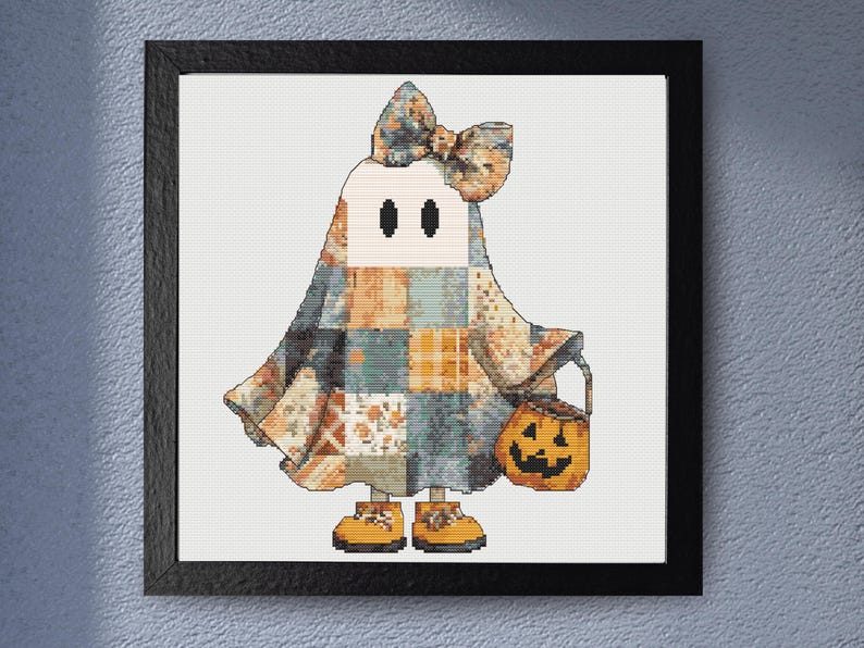 This cute Halloween ghost cross stitch pattern captures the magic of autumn. A playful ghost wrapped in a colorful patchwork costume. Detailed fabric-style blocks in orange, cream, blue, and grey create a cozy handcrafted appearance, while the oversized bow and pumpkin bucket add festive charm. Designed for lovers of cottagecore style, Halloween decorations and seasonal embroidery,  this pattern offers a heartwarming stitching experience and beautiful finished display piece.