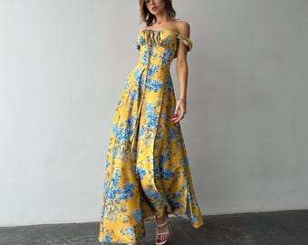 Gele zijden maxi-jurk met bloemen, bustiertop, zijsplit