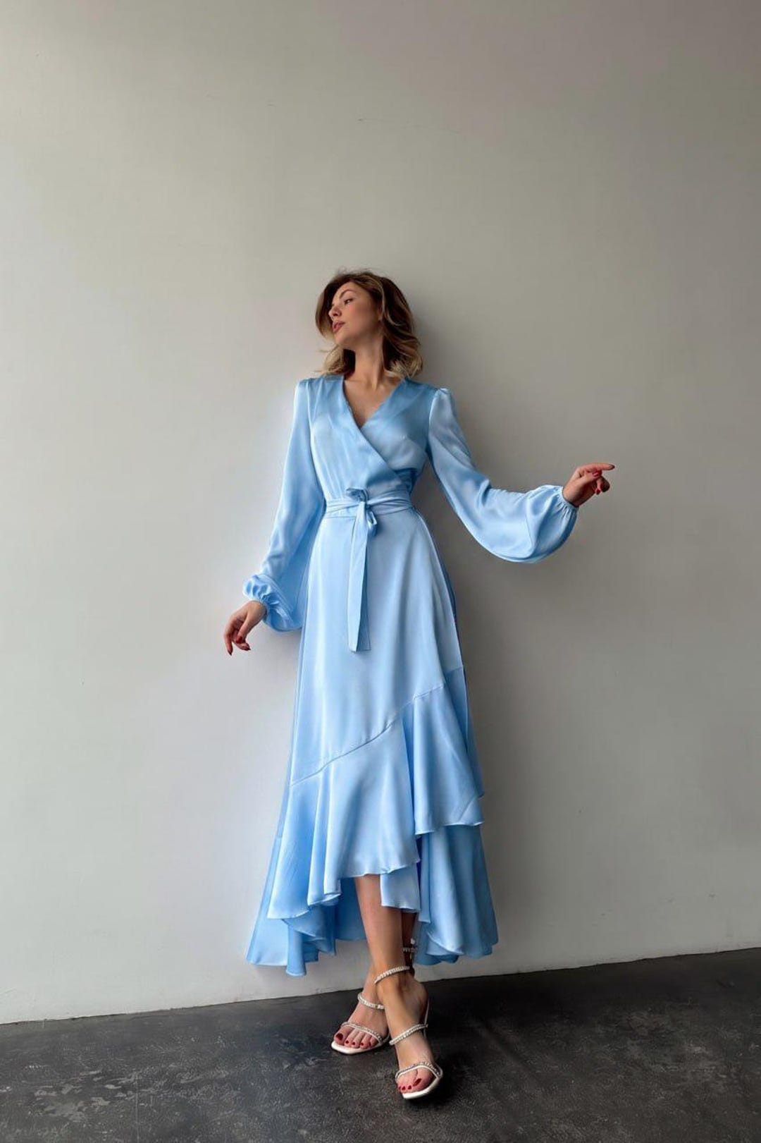 Light Blue Satin Wrap Maxi Dress with Ruffle Skirt and Bracelet Sleeves Light Blue Satin Wrap Maxi Dress with Ruffle Skirt and Bracelet Sleeves