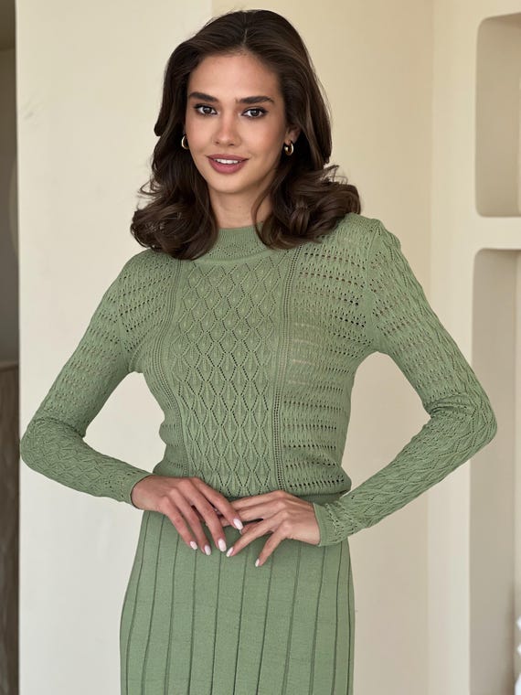 Sage green knit midi dress with long sleeves, pleated skirt