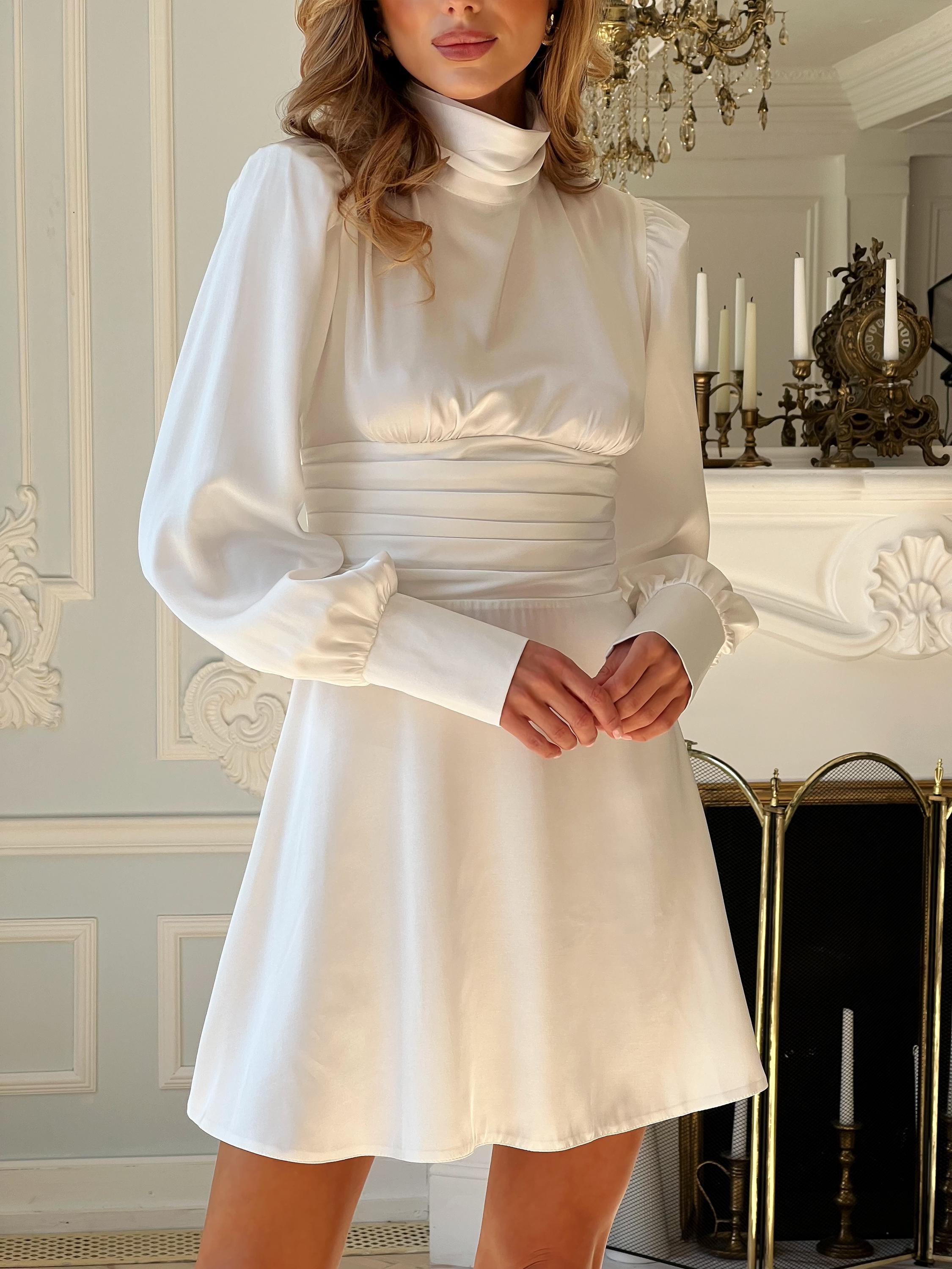 long sleeve cream sweater dress Janie & Jack cream & gold long sleeve sweater dress with ruffle details down front and on wrist/neck. Size 18-24m