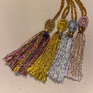Set of 4 decorative hanging tassels with mini bells - silver, gold, rose & multicolour. 3inc/7.5cms long.