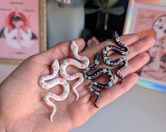 Pastel floral on black or white snakes | handmade clay earrings