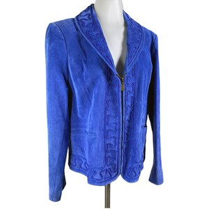 May include: A royal blue suede jacket with a zipper closure and decorative stitching around the collar and front.