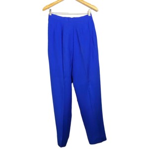 May include: A pair of royal blue high-waisted pants.