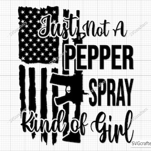 May include: Black and white graphic design with an American flag, a gun, and the text "Just not a pepper spray kind of girl".