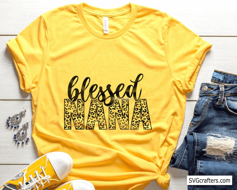 May include: Yellow t-shirt with a black and gold leopard print design that says "blessed nana".