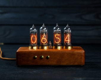 Nixie tube clock  (IN-14 tubes), made of eucalyptus and brass .