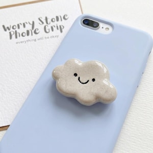 May include: A set of three ceramic nesting bowls in shades of blue, green, and white. The bowls have a speckled glaze and a simple, modern design. The largest bowl is about 15 cm in diameter.