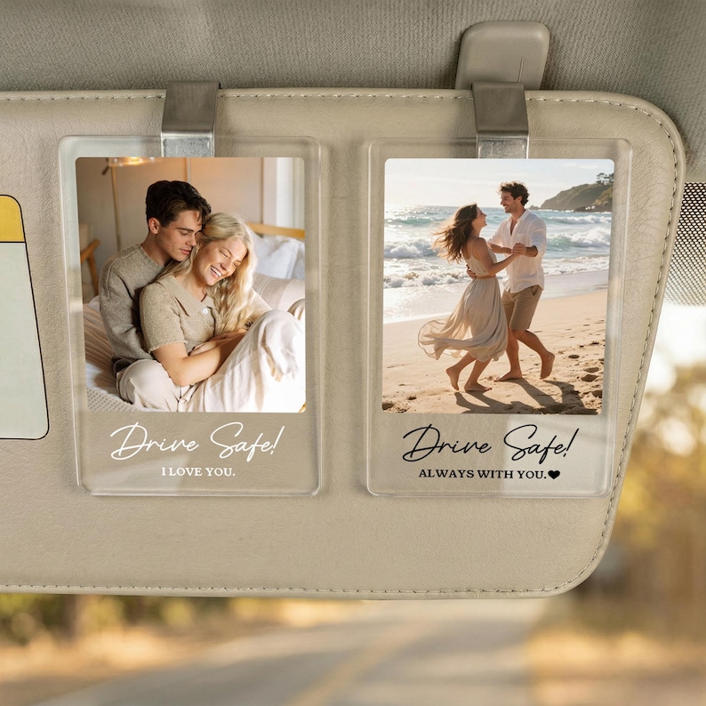 May include: Two rectangular clear acrylic car visor clips featuring custom photo prints. The left clip shows a couple embracing with the text Drive Safe! I LOVE YOU. The right clip shows a couple on a beach with the text Drive Safe! ALWAYS WITH YOU.