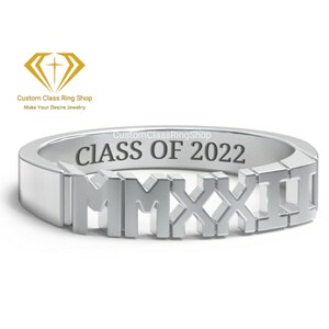 May include: Silver class ring with the inscription "CLASS OF 2022" and the year "MMXXII" in Roman numerals.