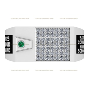 May include: A silver class ring with a black and white background. The ring has a green stone and the text "2025 OUR NAME" on one side and "BATH COUNTY HIGH SCHOOL" on the other side.