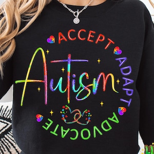 May include: Black sweatshirt with a rainbow-colored graphic that says "Accept, Adapt, Advocate, Autism".