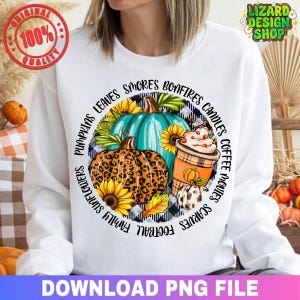 May include: White sweatshirt with a fall-themed graphic. The design features pumpkins, sunflowers, and a coffee cup, surrounded by text including "leaves," "bonfires," and "scarves." The image also includes the text "DOWNLOAD PNG FILE."