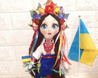 Ukrainian doll in Ukrainian national folk costume with a wreath, fabric textile rag soft handmade art doll