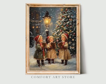May include: A framed vintage Christmas print depicts three children singing carols in the snow. They wear red hats and coats, holding songbooks near a lit lamppost and decorated Christmas tree. The artwork is from Comfort Art Store.