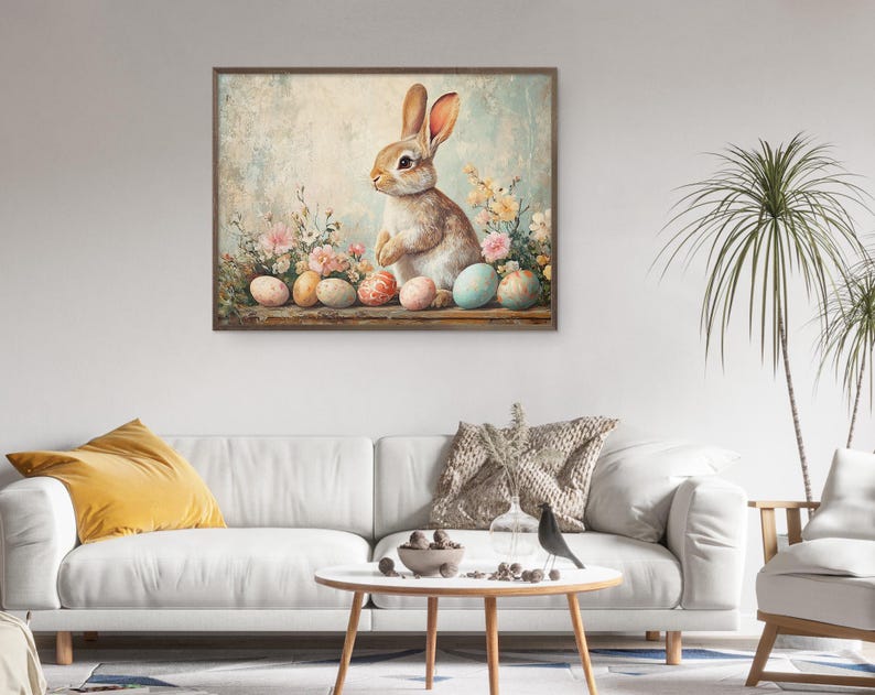 Puede incluir: Un conejo marr&oacute;n y blanco se sienta con las patas cruzadas frente a un fondo azul pastel. El conejo est&aacute; rodeado de huevos de Pascua de color pastel y flores de primavera.